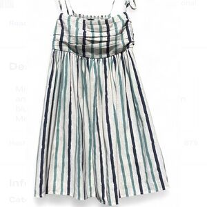 Midi dress featuring a smocked bodice and a flowing skirt